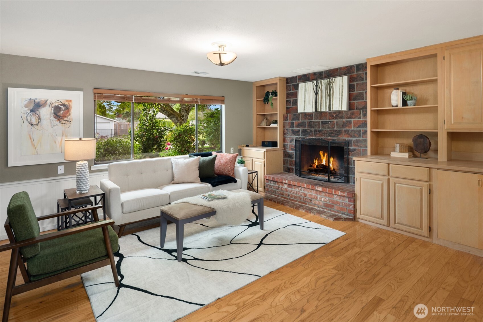 418 212th Street Southwest Bothell, WA 98021 - Photo 23 of 40 a living room with furniture a large window and a fireplace