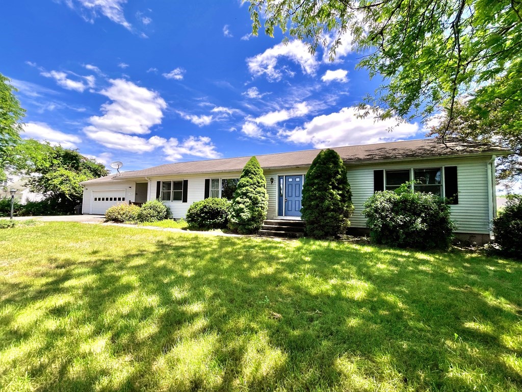 192 Hadley Road Sunderland, MA 01375 - Photo 1 of 30 a front view of house with yard and green space