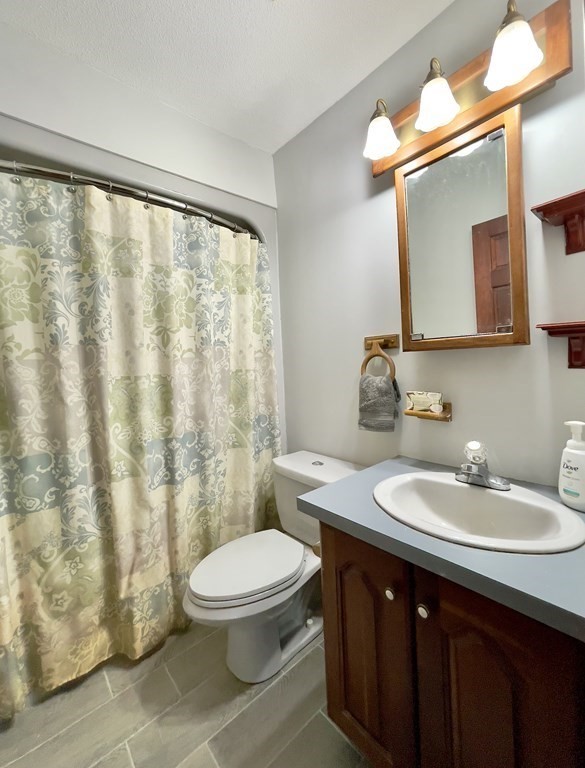 192 Hadley Road Sunderland, MA 01375 - Photo 13 of 30 a bathroom with a sink vanity mirror and toilet