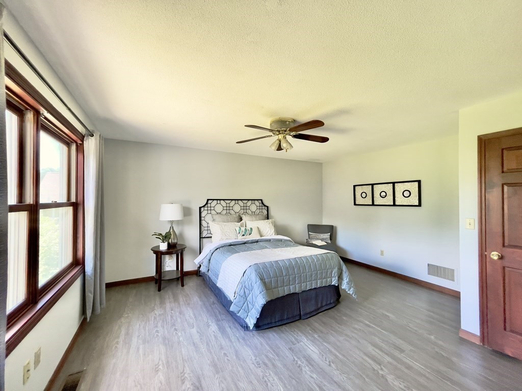 192 Hadley Road Sunderland, MA 01375 - Photo 17 of 30 a bedroom with a bed and a large window