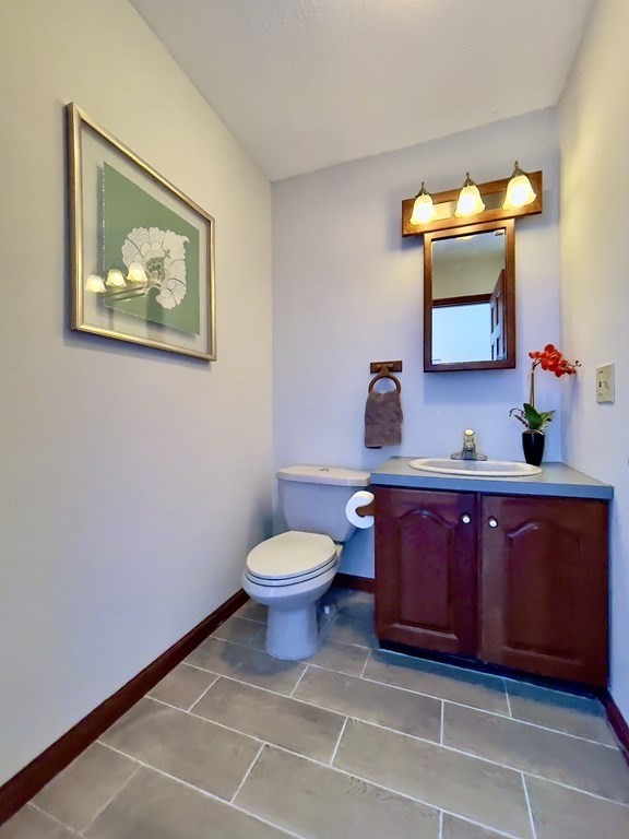 192 Hadley Road Sunderland, MA 01375 - Photo 20 of 30 a bathroom with a toilet a sink and mirror