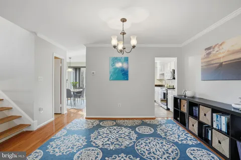 a bedroom with furniture and a rug