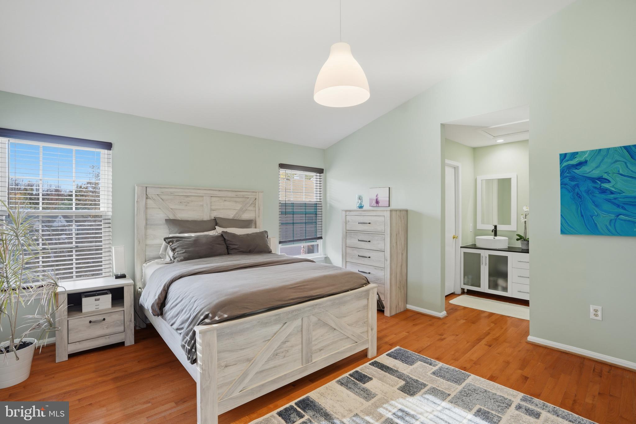 6172 Forest Creek Court Springfield, VA 22152 - Photo 28 of 42 a bedroom with bed and wooden floor