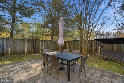 a view of a table and chairs in the patio