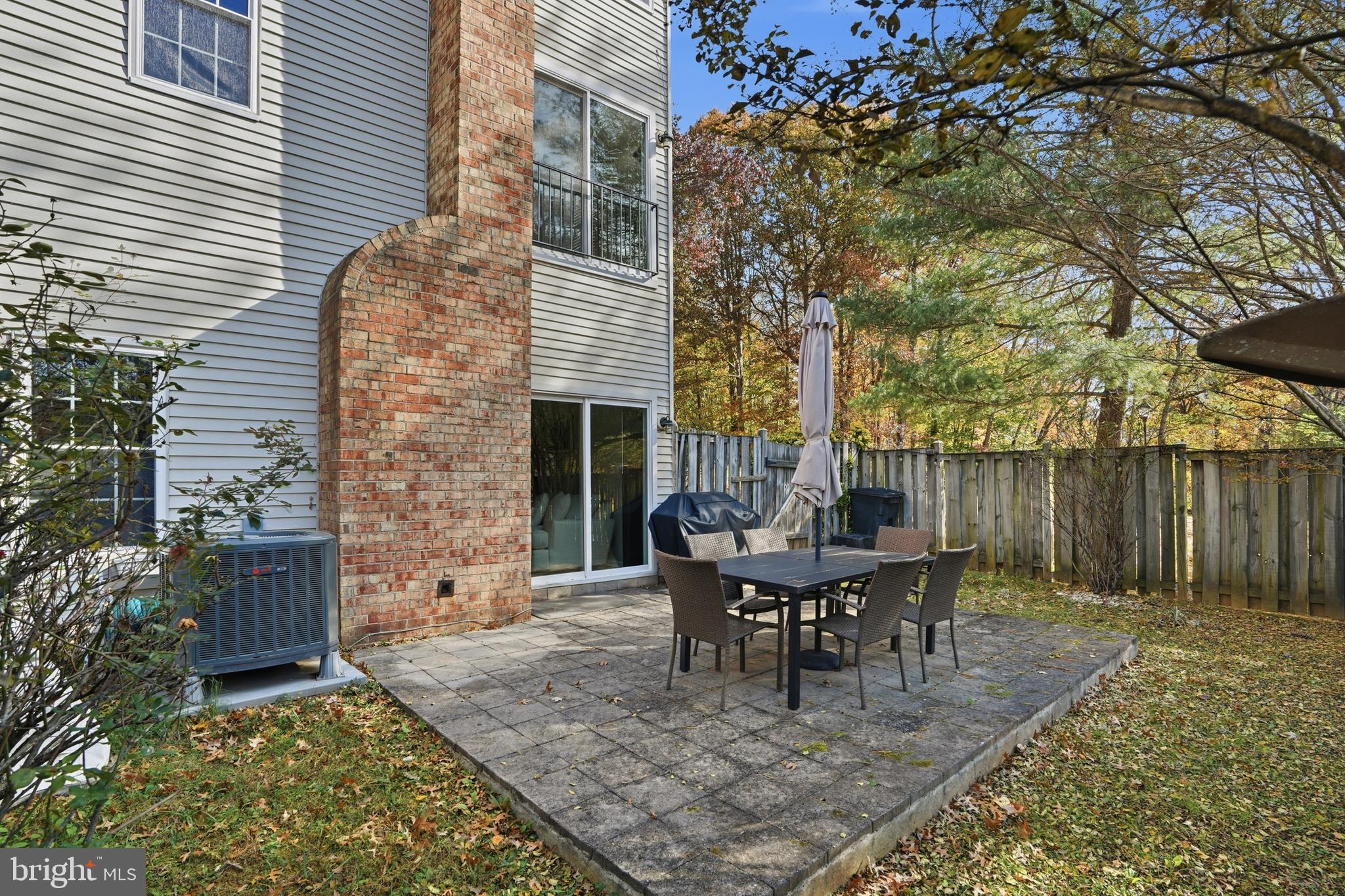 6172 Forest Creek Court Springfield, VA 22152 - Photo 41 of 42 a view of a house with patio and a yard