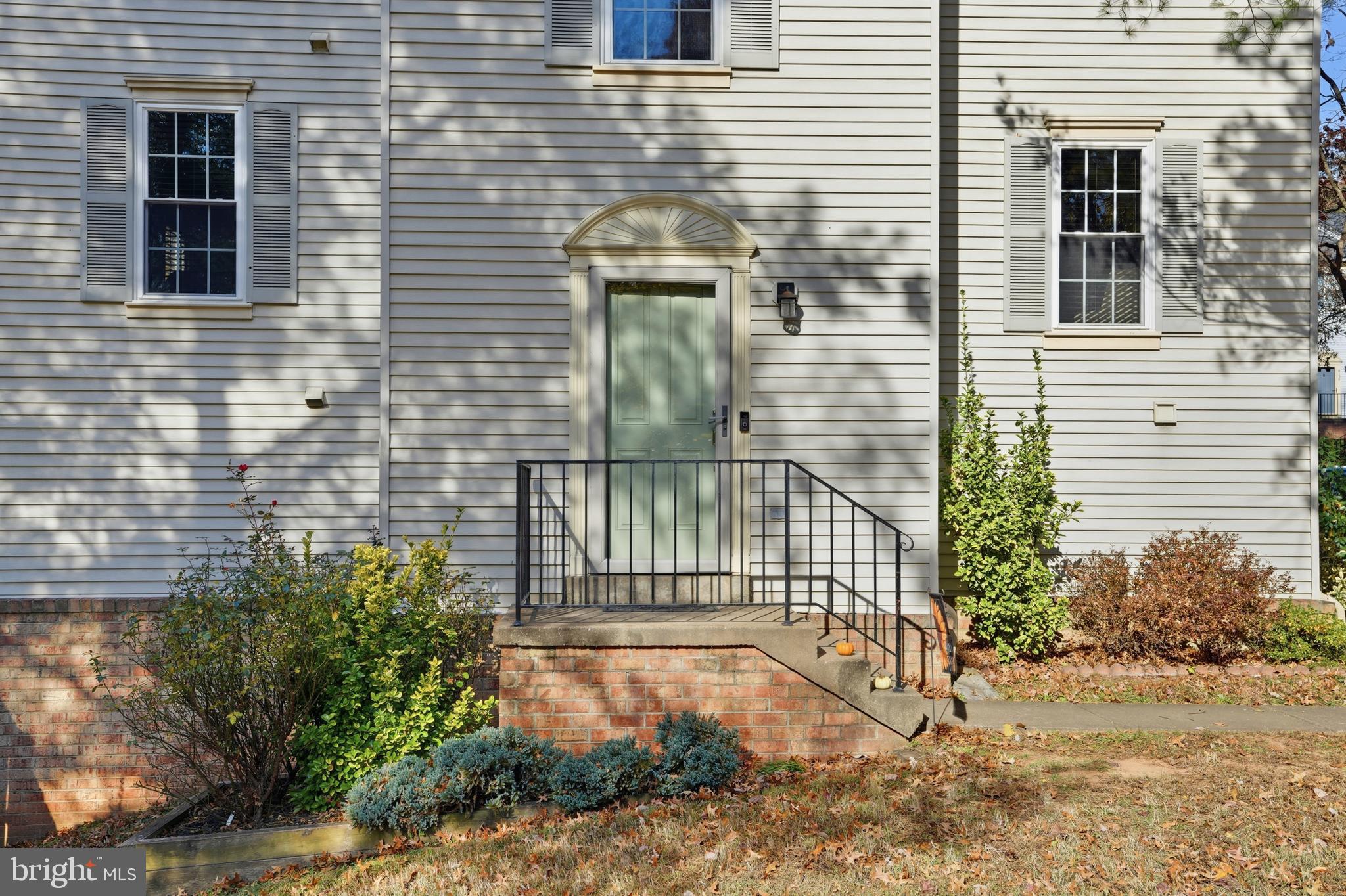 6172 Forest Creek Court Springfield, VA 22152 - Photo 5 of 42 a view of a brick house with many windows