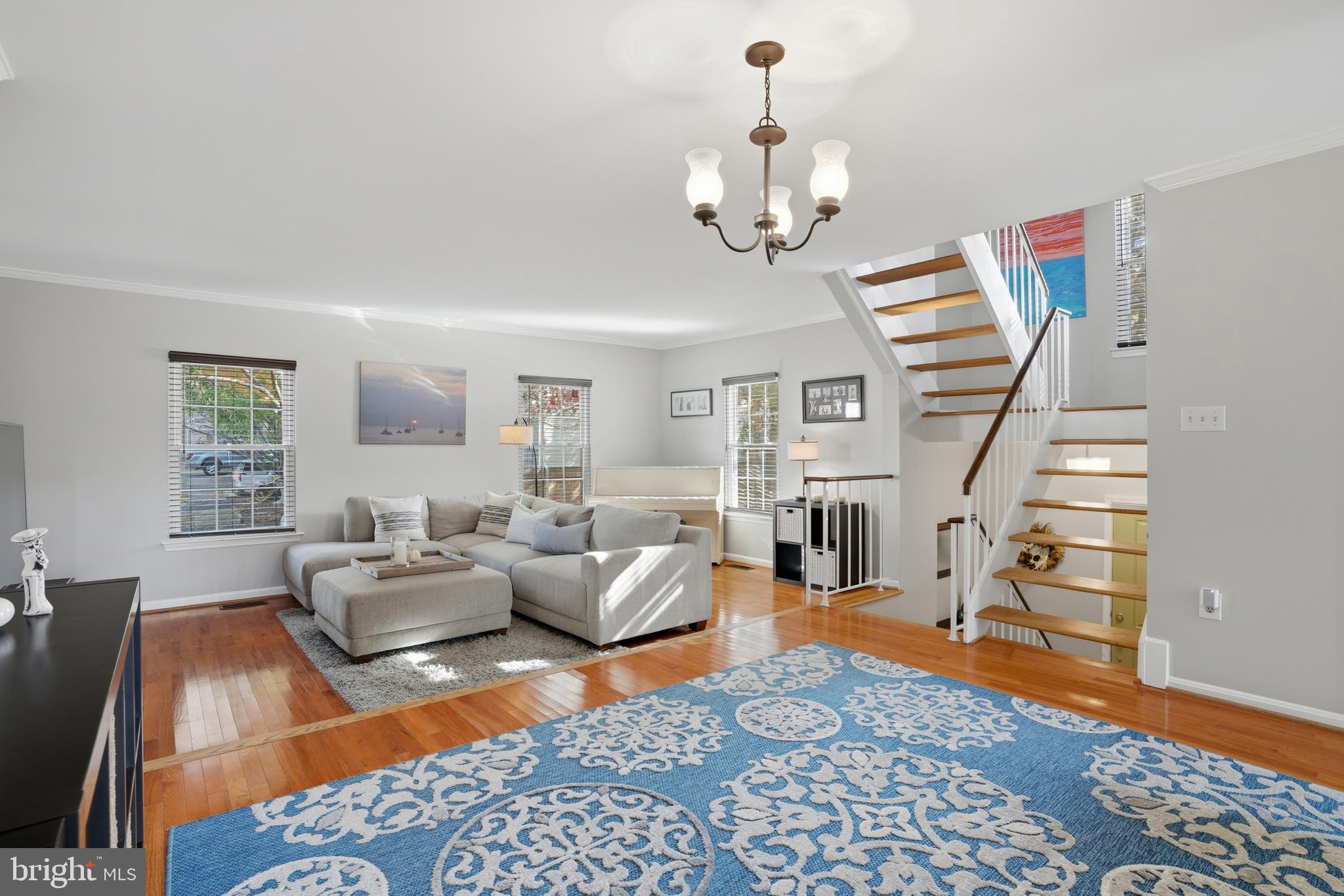 6172 Forest Creek Court Springfield, VA 22152 - Photo 6 of 42 a living room with furniture and wooden floor
