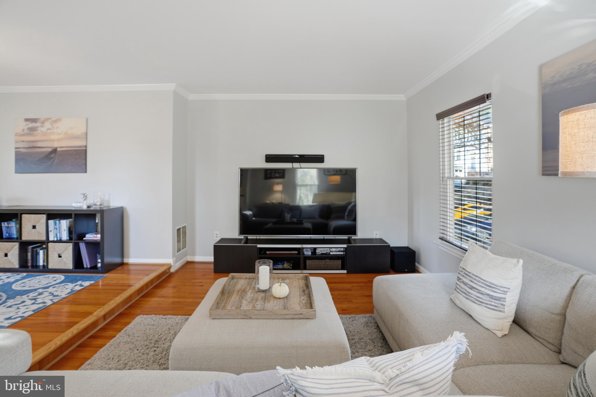 6172 Forest Creek Court Springfield, VA 22152 - Photo 8 of 42 a living room with furniture and a flat screen tv