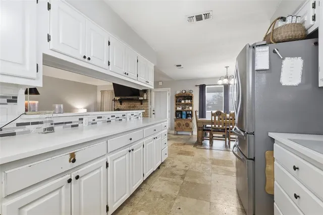 a large kitchen with cabinets