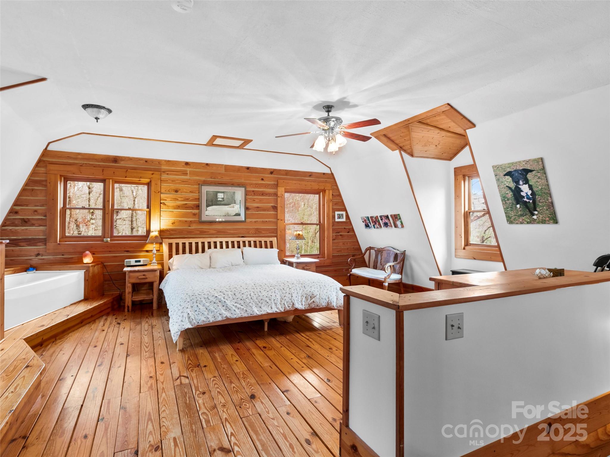 1239 Lower Loop Drive Fletcher, NC 28732 - Photo 14 of 24 a bedroom with a bed and a balcony