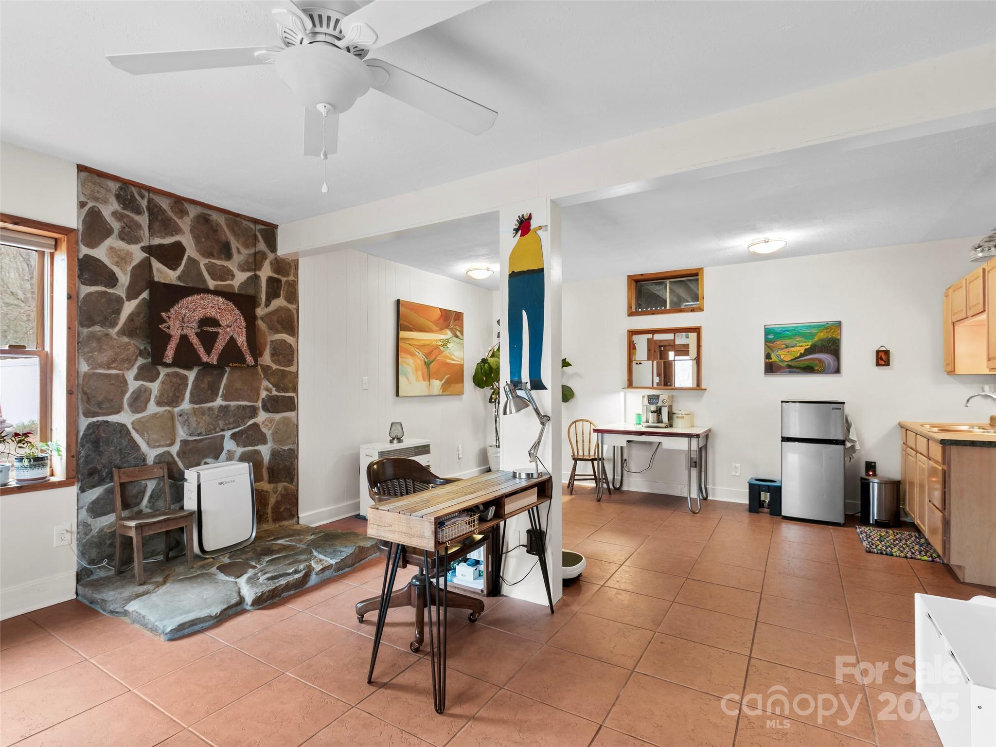 1239 Lower Loop Drive Fletcher, NC 28732 - Photo 17 of 24 a workspace with furniture and a chandelier fan