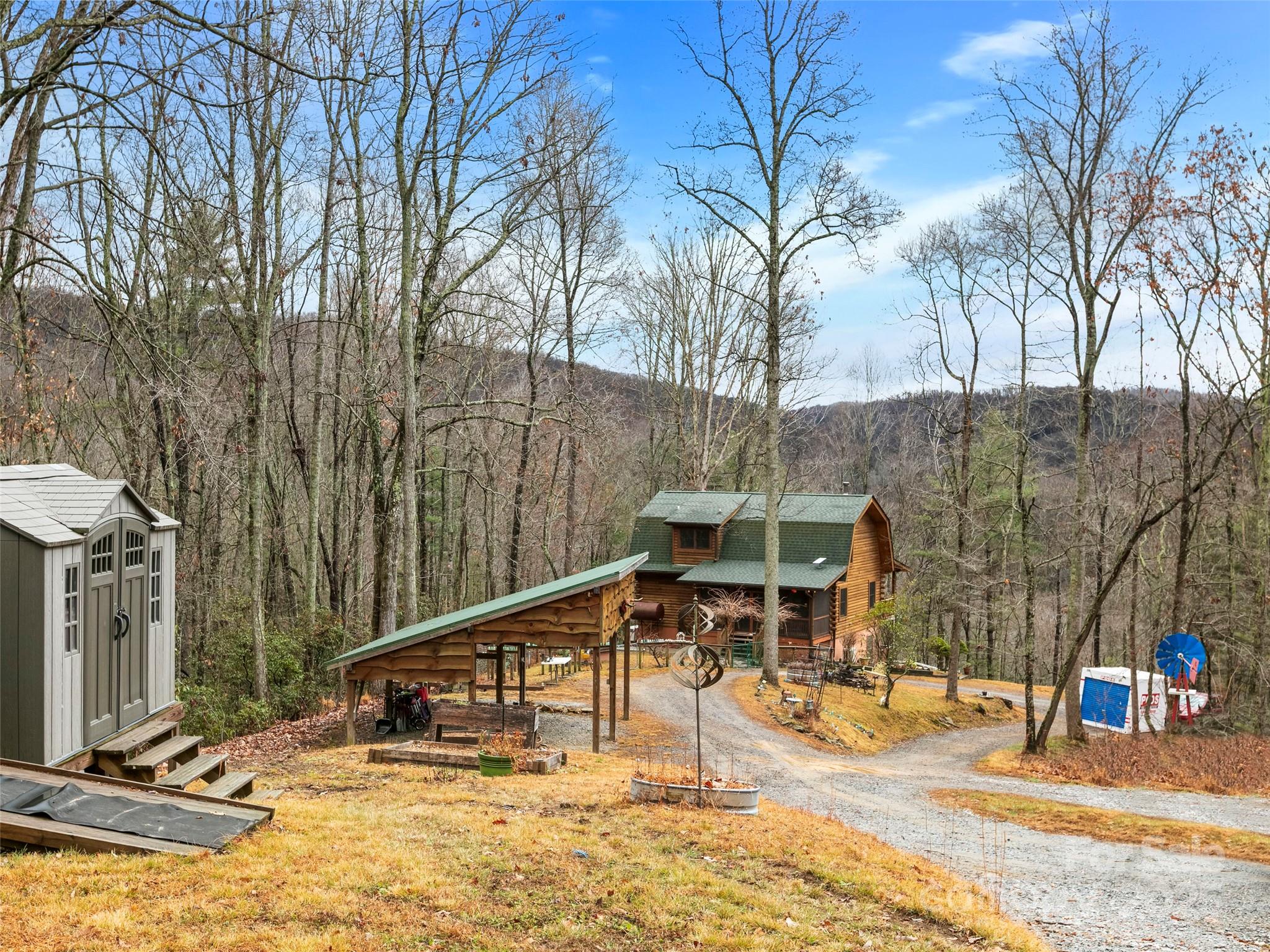 1239 Lower Loop Drive Fletcher, NC 28732 - Photo 23 of 24 a view of a house with a patio