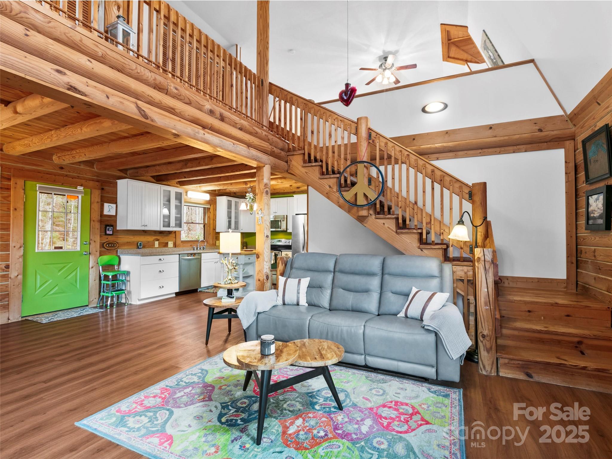 1239 Lower Loop Drive Fletcher, NC 28732 - Photo 8 of 24 a living room with furniture and a dining table with wooden floor