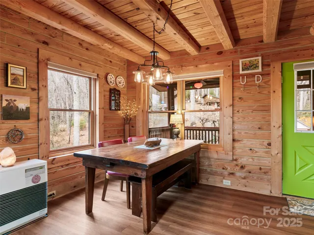 a view of a livingroom with workspace and a window