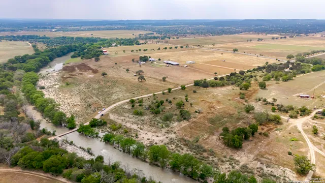 a view of a patio with a table and chairs and wooden floor