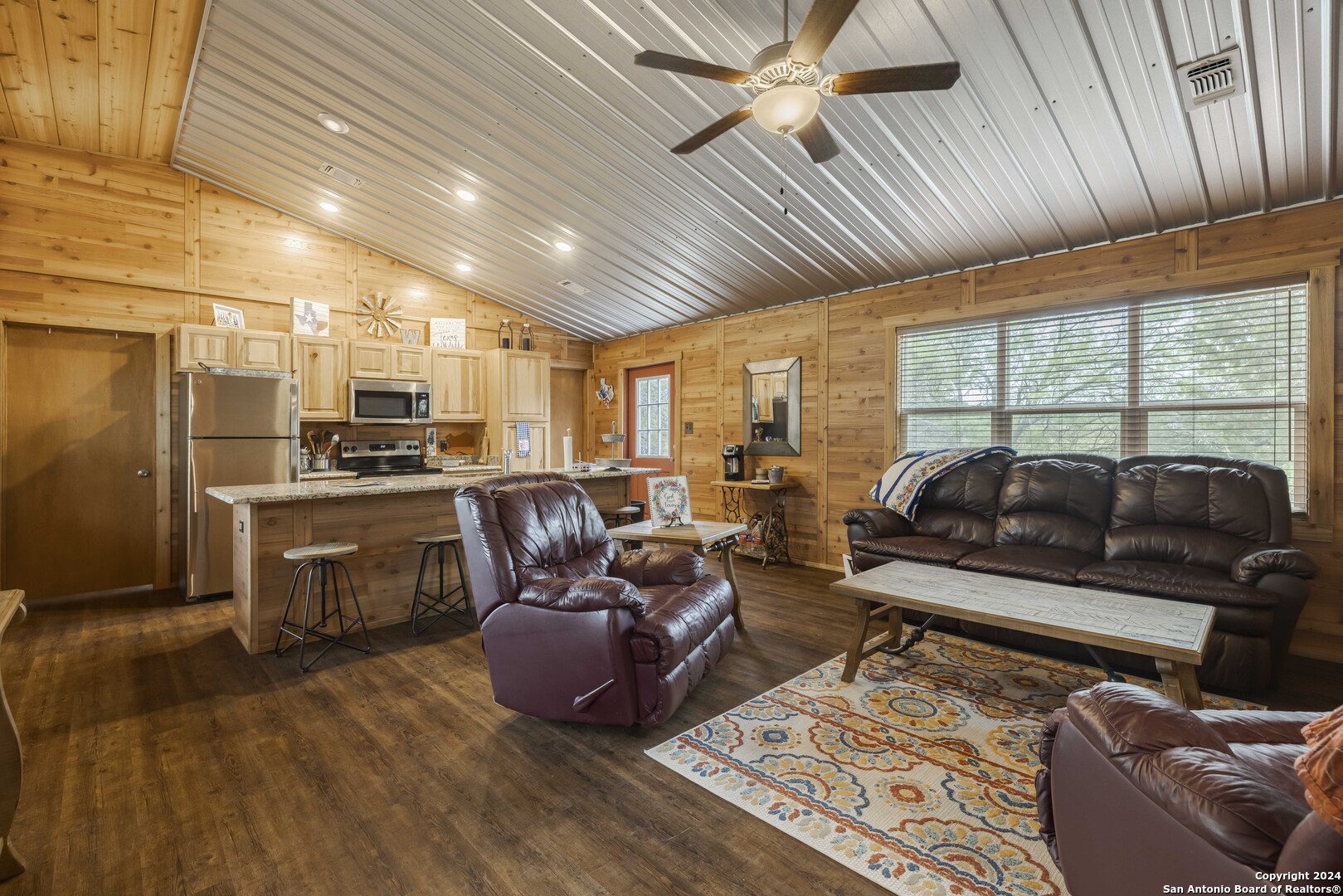 106 Homilius Road Comfort, TX 78013 - Photo 13 of 45 a living room with furniture kitchen view and a large window