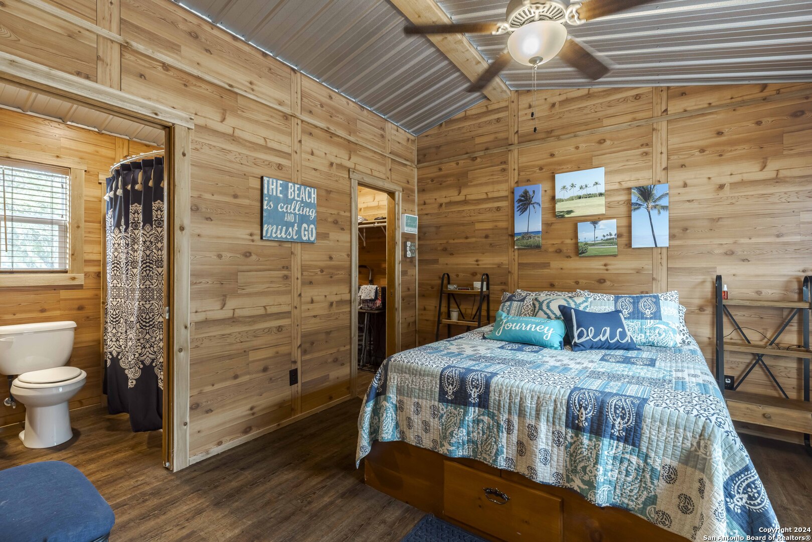 106 Homilius Road Comfort, TX 78013 - Photo 18 of 45 a bedroom with a bed and wooden floor