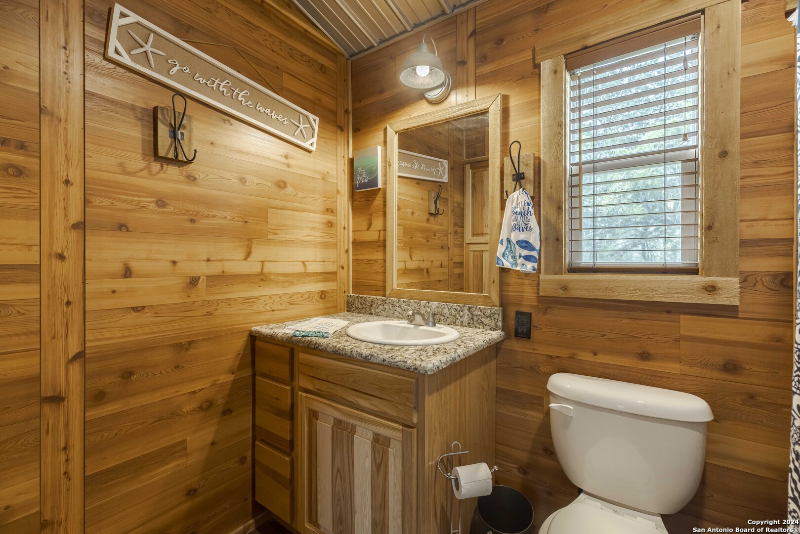 106 Homilius Road Comfort, TX 78013 - Photo 20 of 45 a bathroom with a granite countertop sink toilet and shower