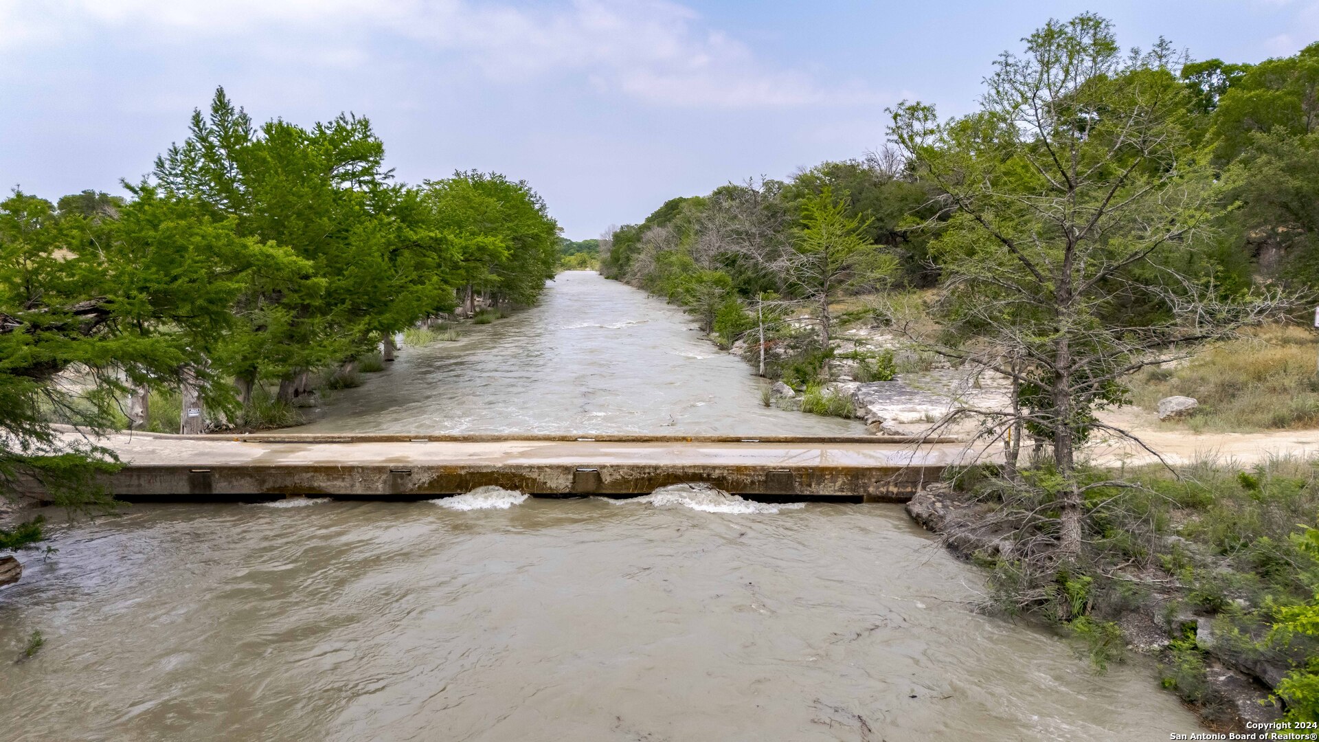 106 Homilius Road Comfort, TX 78013 - Photo 2 of 45 a view of a swimming pool with a yard
