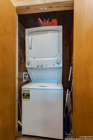 an aerial view of a house with a yard and lake view