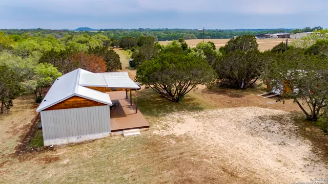 an aerial view of residential houses with outdoor space