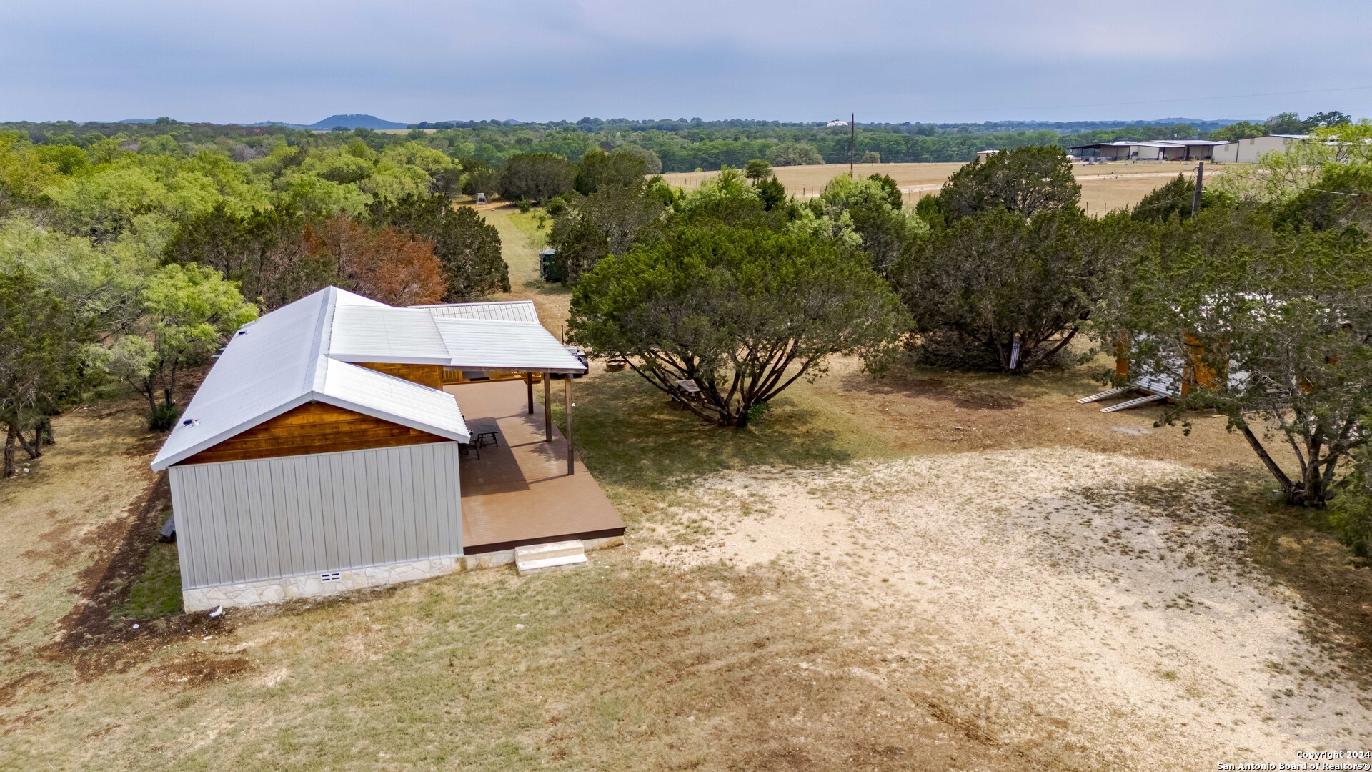 106 Homilius Road Comfort, TX 78013 - Photo 25 of 45 an aerial view of a house with a yard and lake view