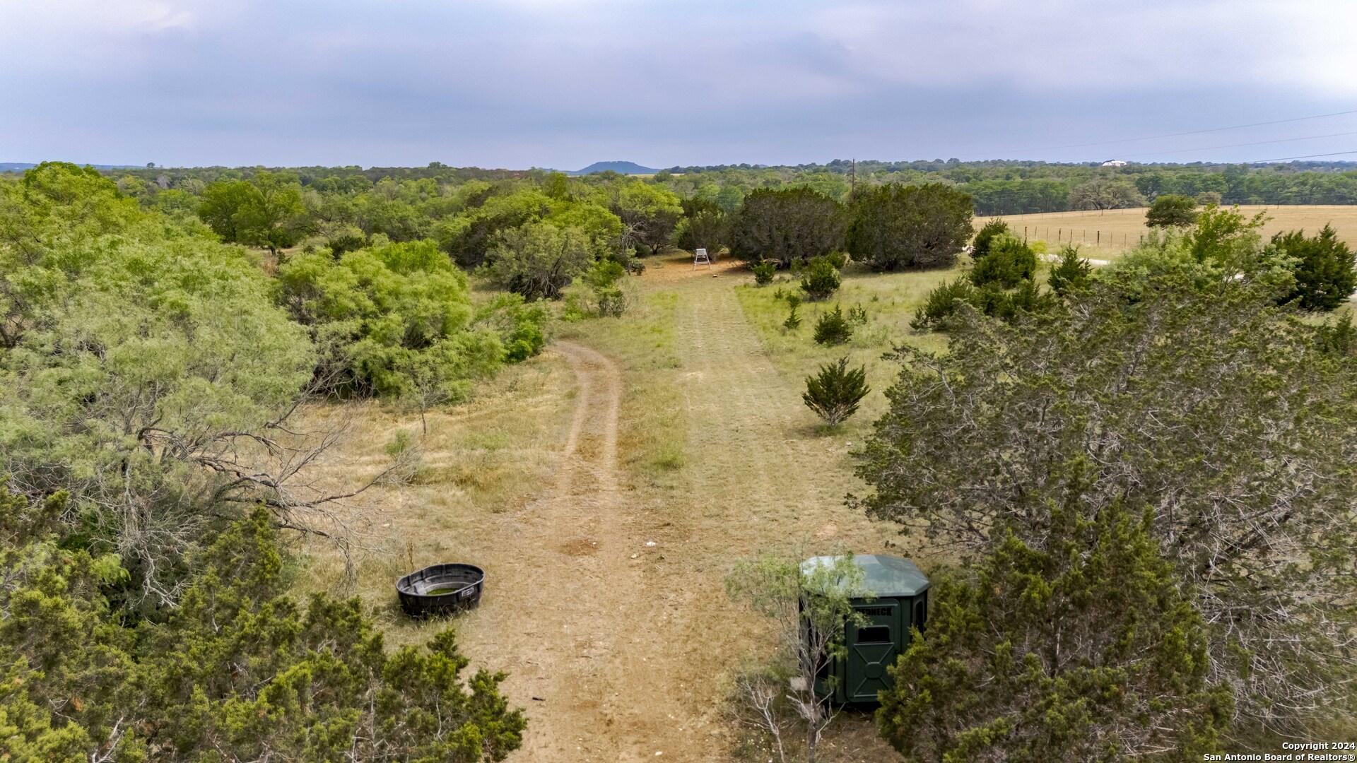 106 Homilius Road Comfort, TX 78013 - Photo 30 of 45 a view of a lake with a mountain in the background