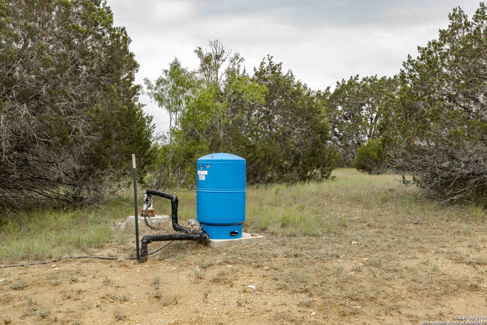 106 Homilius Road Comfort, TX 78013 - Photo 31 of 45 a fire hydrant sitting in the middle of a yard