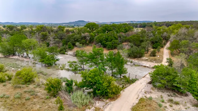a view of a lake with a yard