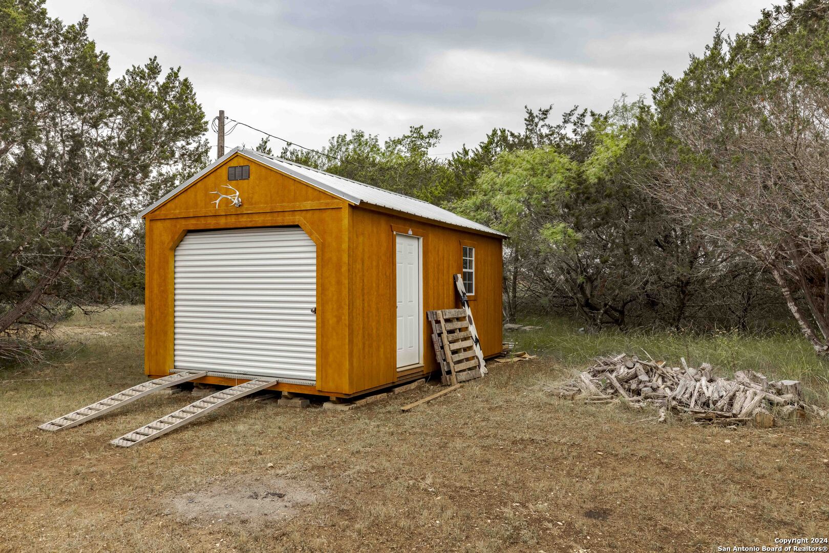 106 Homilius Road Comfort, TX 78013 - Photo 8 of 45 a front view of a house with a yard