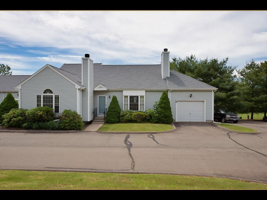 83 Stage Coach Road, Unit 4 Durham, CT 06422 - Photo 1 of 1 a front view of a house with a yard and garage