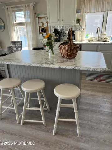 a kitchen with a table chairs and a stove