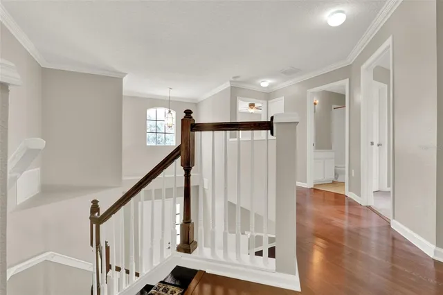 a view of an entryway with wooden floor