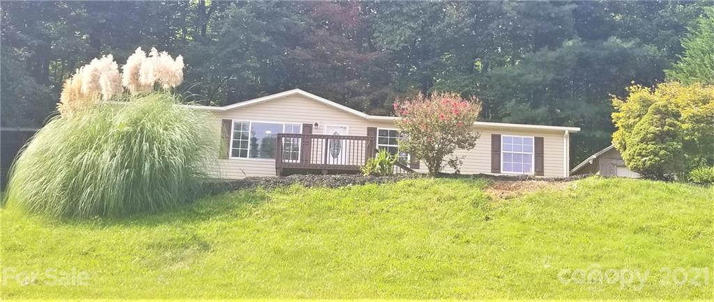 4880 Crystal Creek Road Morganton, NC 28655 - Photo 2 of 26 a front view of a house with garden