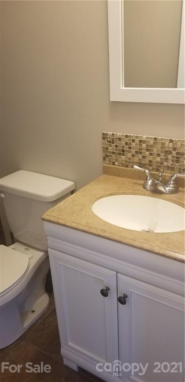 4880 Crystal Creek Road Morganton, NC 28655 - Photo 11 of 26 a bathroom with a toilet and a sink