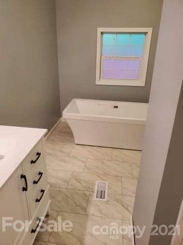 4880 Crystal Creek Road Morganton, NC 28655 - Photo 5 of 26 a bathroom with a bathtub and shower