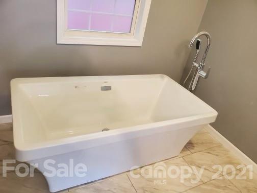 4880 Crystal Creek Road Morganton, NC 28655 - Photo 6 of 26 a bathroom with a bathtub