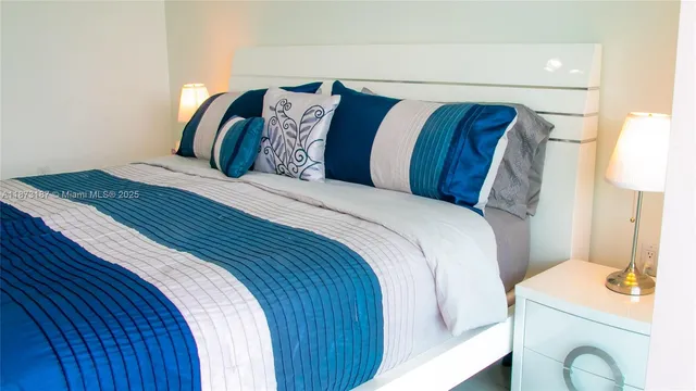 a bedroom with a bed and a sink