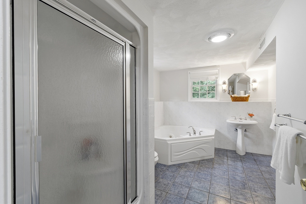 9 Donald Road Billerica, MA 01821 - Photo 20 of 36 a bathroom with a sink a toilet and bathtub