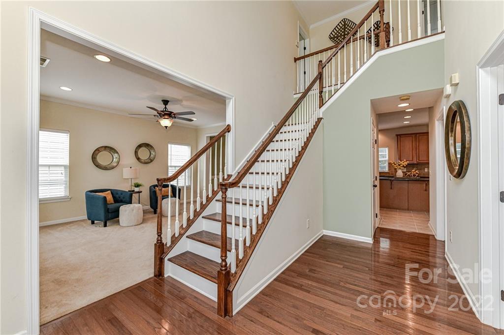 7179 Meyer Road Fort Mill, SC 29715 - Photo 29 of 47 a view of entryway and hall with wooden floor