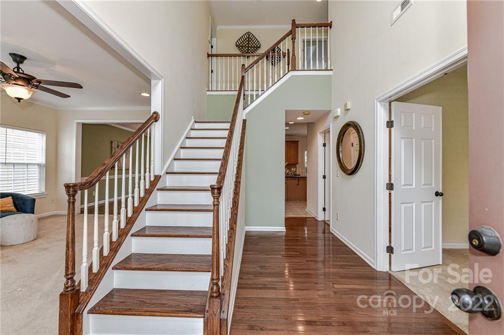 7179 Meyer Road Fort Mill, SC 29715 - Photo 6 of 47 a view of entryway and hall with wooden floor