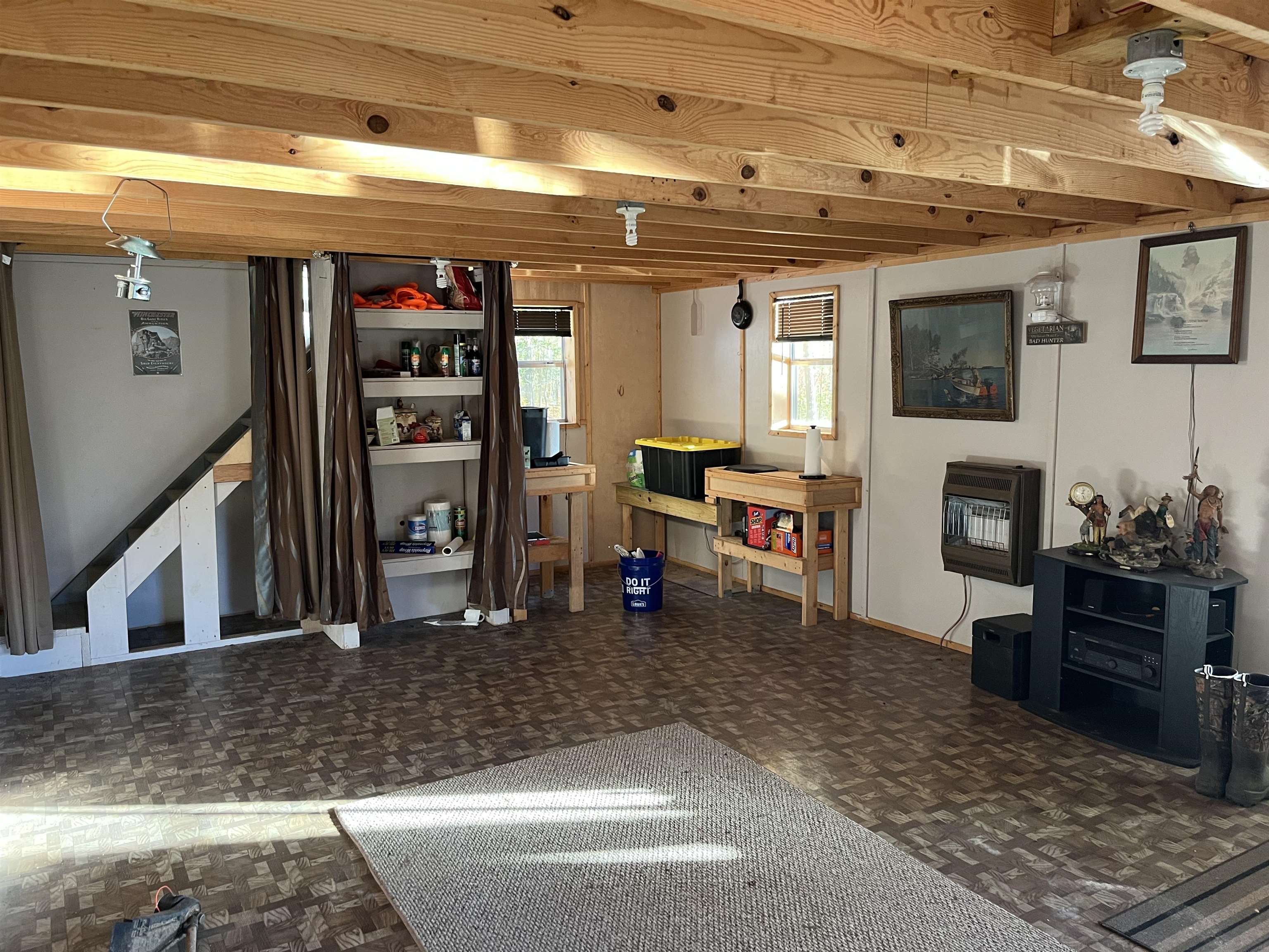 2255 Cr 105 Road Walnut, MS 38683 - Photo 30 of 31 a living room with furniture a flat screen tv and a fireplace