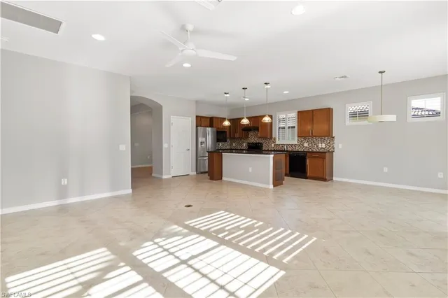 a front view of a house with a yard table and chairs