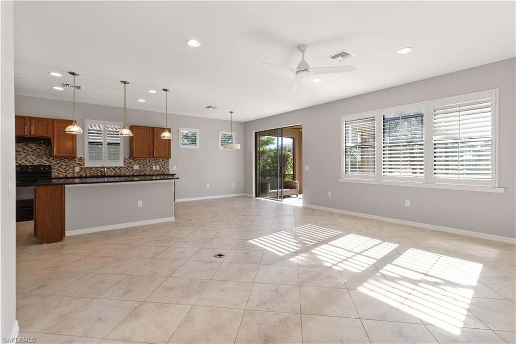 6068 Triumph Lane Ave Maria, FL 34142 - Photo 27 of 27 a large white kitchen with a large window