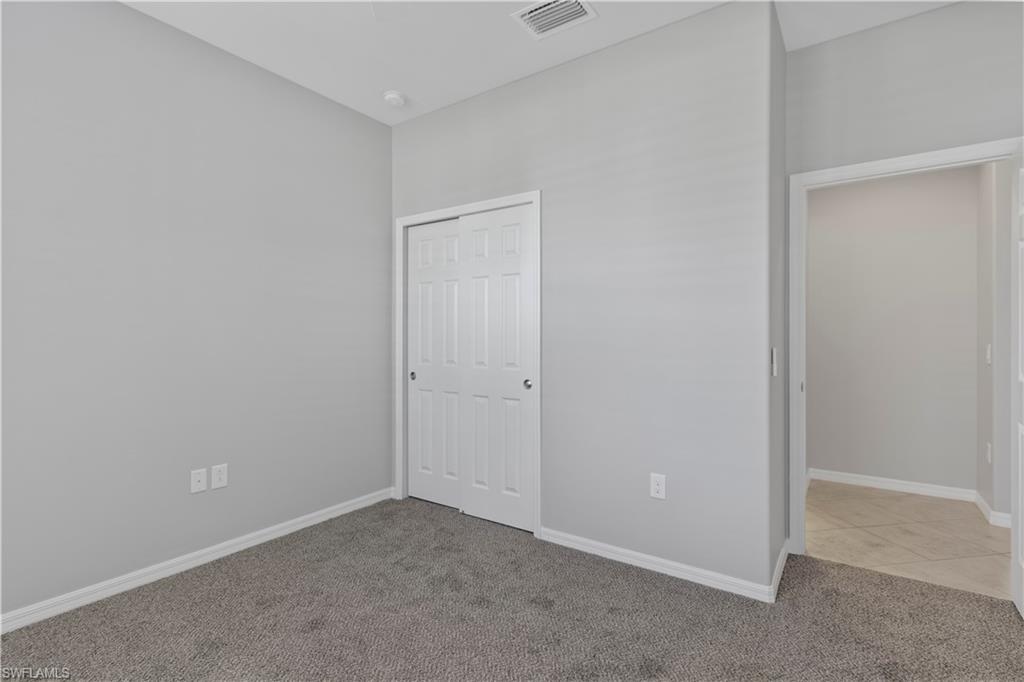 6068 Triumph Lane Ave Maria, FL 34142 - Photo 7 of 27 a view of an empty room
