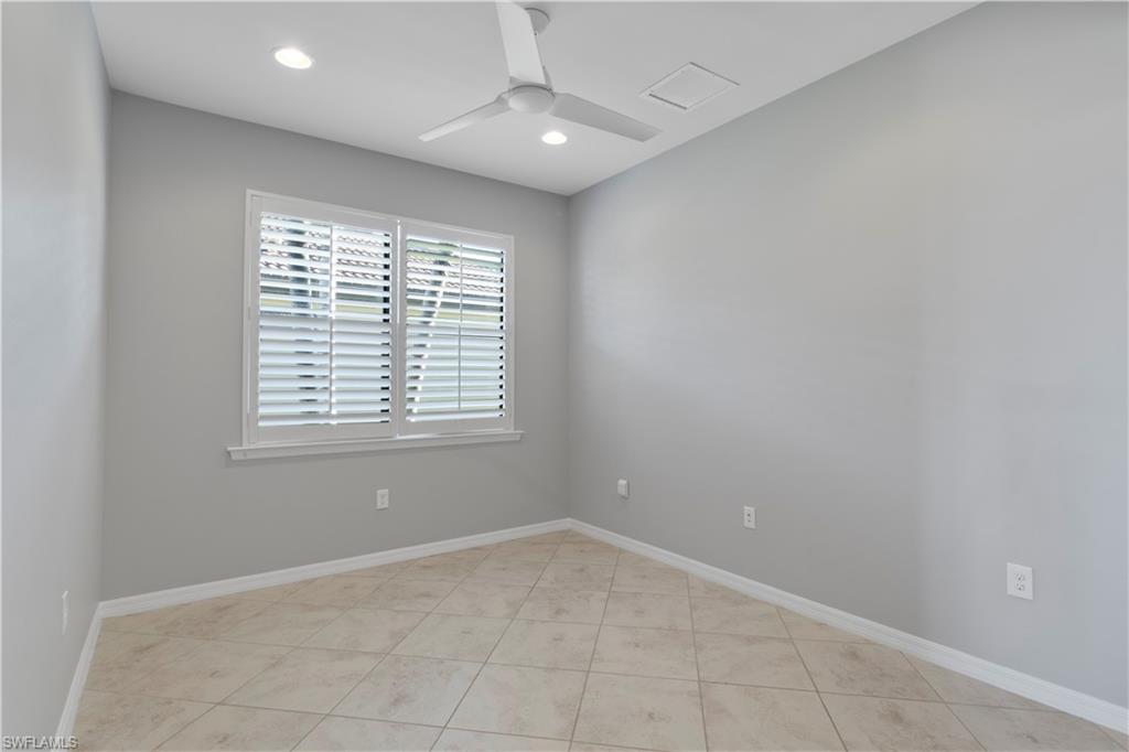 6068 Triumph Lane Ave Maria, FL 34142 - Photo 10 of 27 an empty room with a window