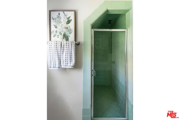 a picture of a bathroom with a shower curtain