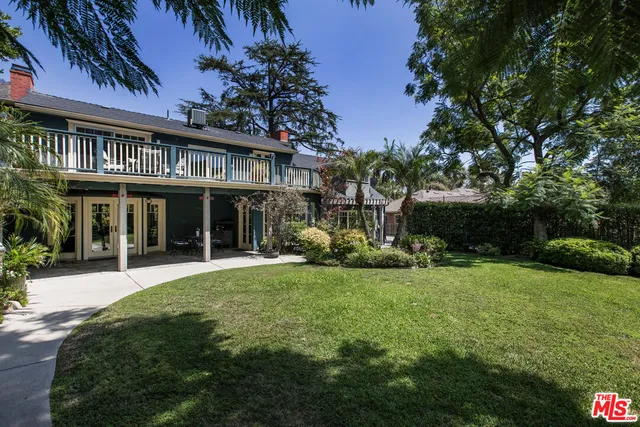 a view of a house with a yard porch and sitting area