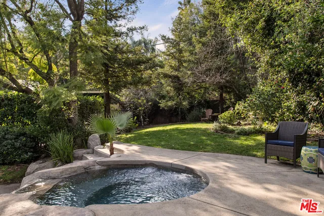 a view of a park with large trees