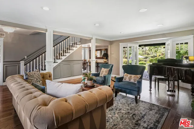 a living room with furniture and a rug
